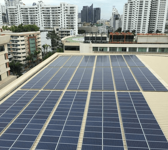 Rooftop solar installation in a city landscape